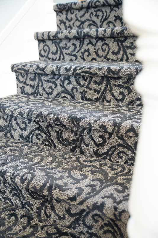 Carpeted stair and iron railings- we were bold with carpet.. the wood railings were replaced with iron to tie in the spiral staircase.