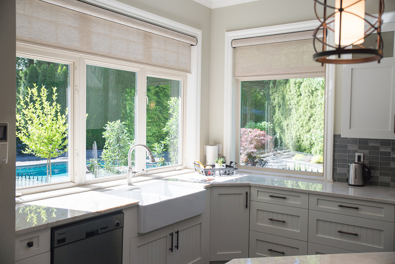 Roller shades replaced traditional fabric topper and updated this home with a clean look.
