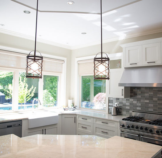 the addition of pendant lights over the island created dimension and interest to this area.