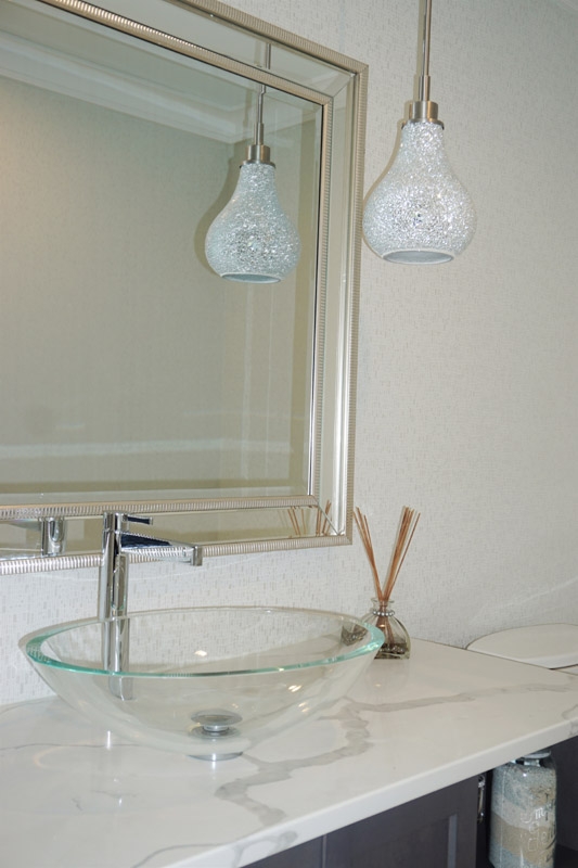 Main floor powder room with a stunning crushed glass pendant light.